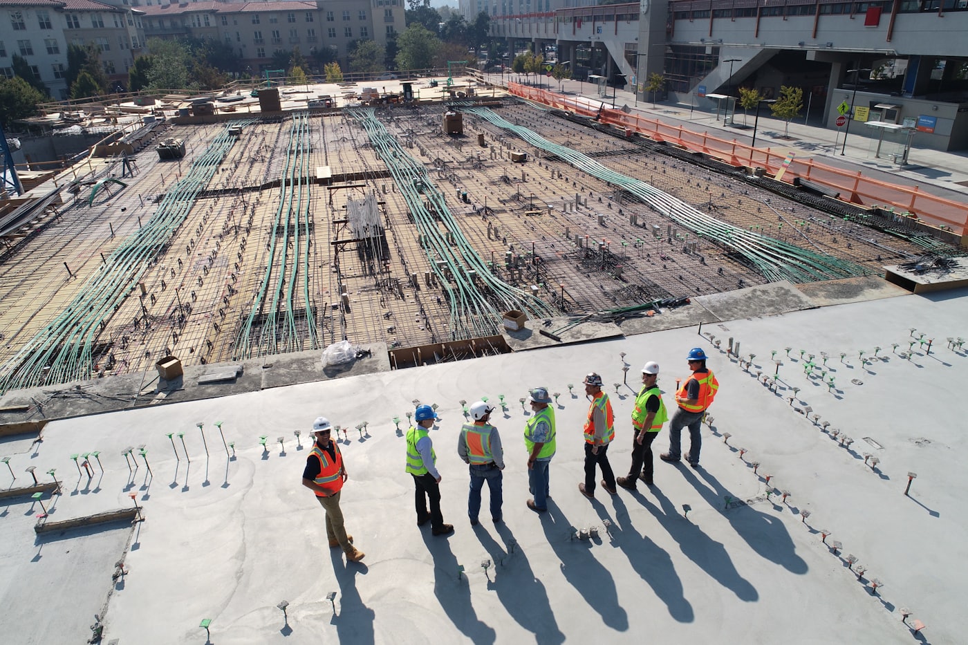 Craftsman reviewing rebuild plans on site